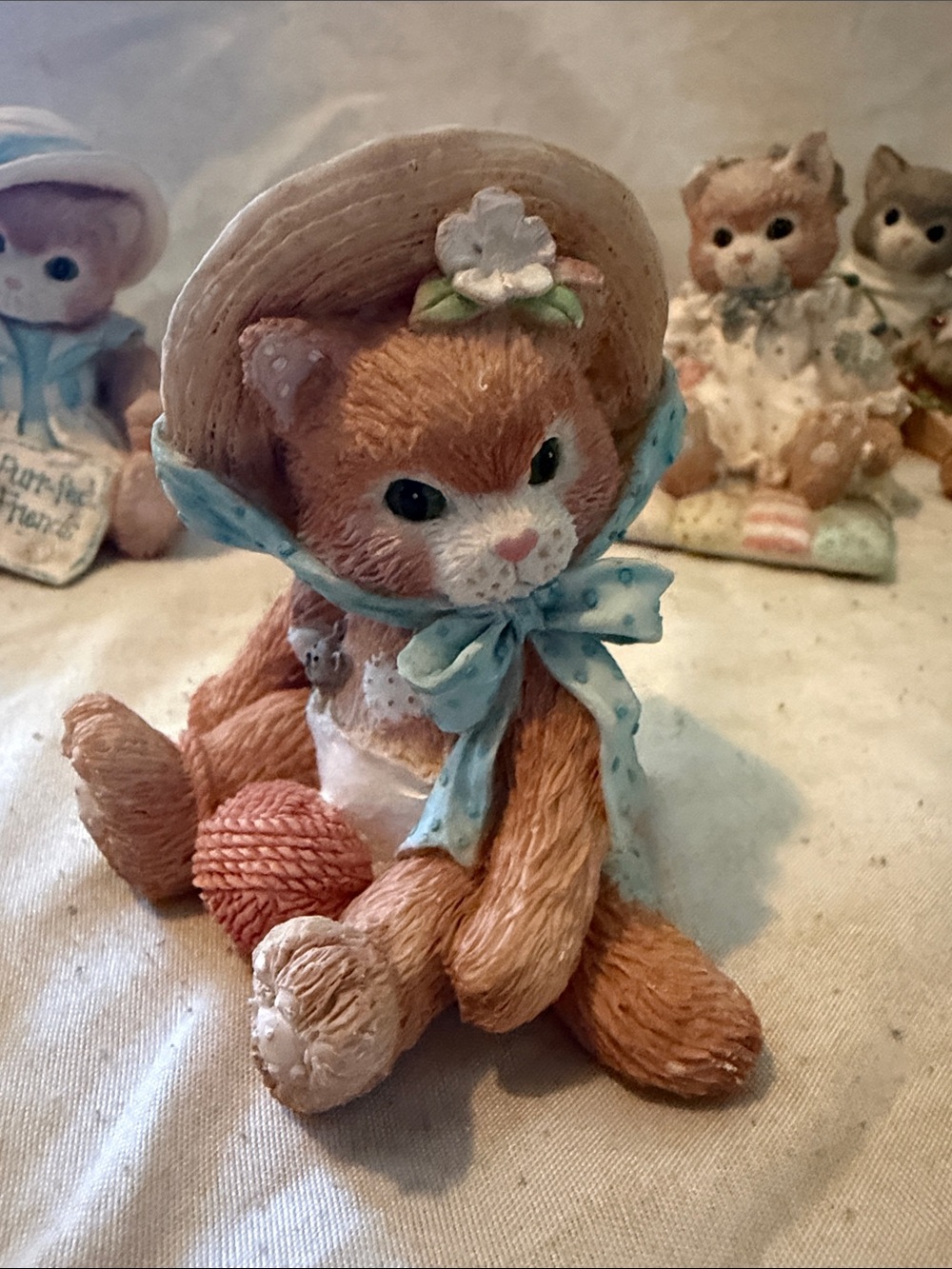 Adorable Orange Cat Figurine with Blue Bow and Straw Hat